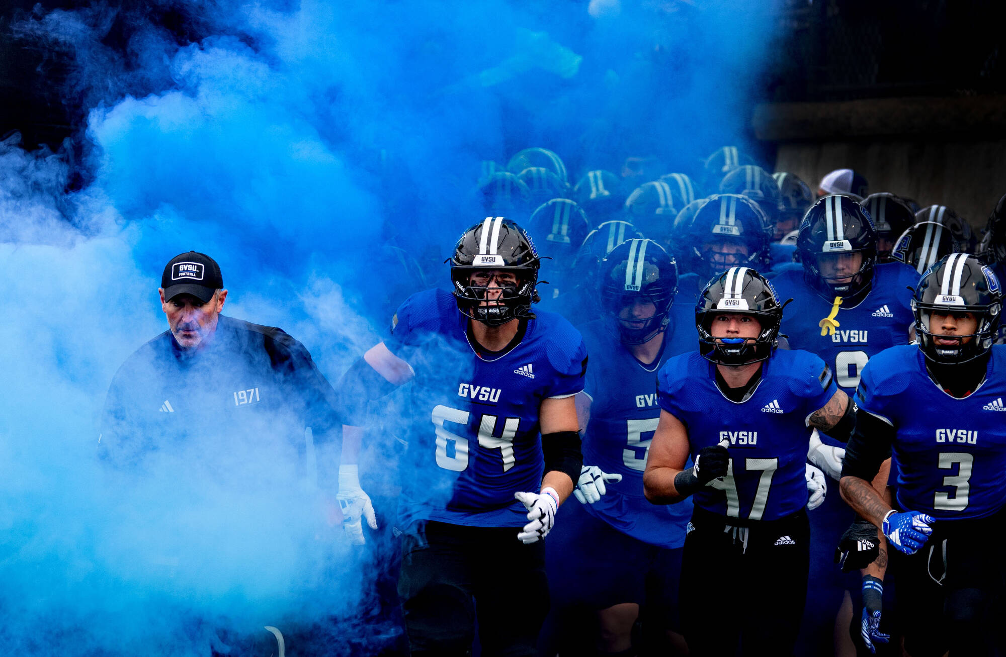The Grand Valley Lakers football team takes the field during the homecoming football game November 8.